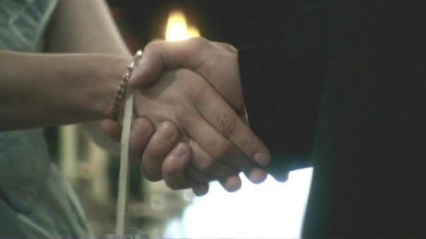 Shaking hands at dinner party