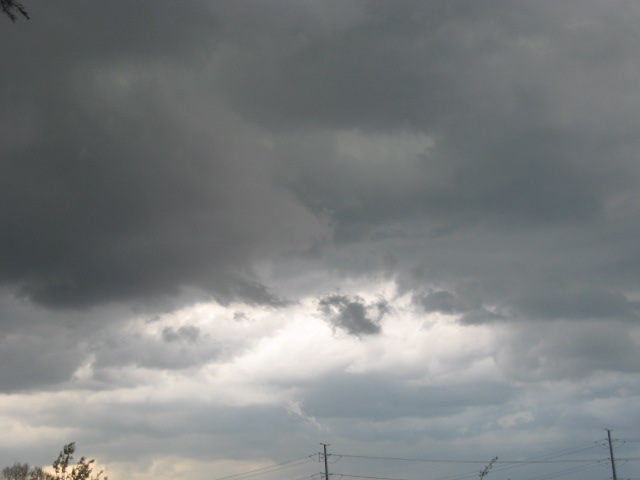 Sun getting swallowed up (just before rain shower)