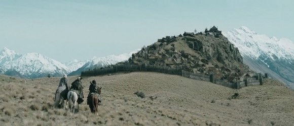 Aragorn, Gimli, and Legolas riding toward Edoras